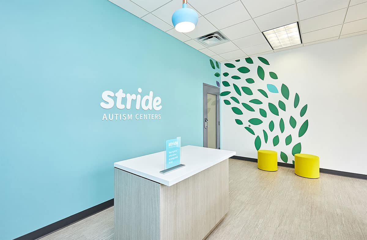 Interior view of the front reception area of the Stride Autism Center for children in Davenport, Iowa.