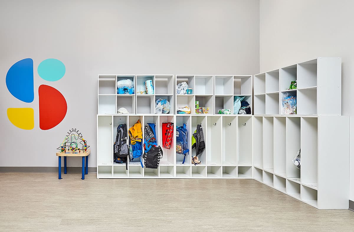 Cubby area where children store their belongings before ABA therapy near Downtown Des Moines, Des Moines, Iowa.