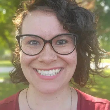shelly-swan-lead-bcba-davenport-iowa-stride-autism-centers Selfie shot of a woman wearing a cat's eye-rimmed eyeglasses, smiling while looking straight at the camera.