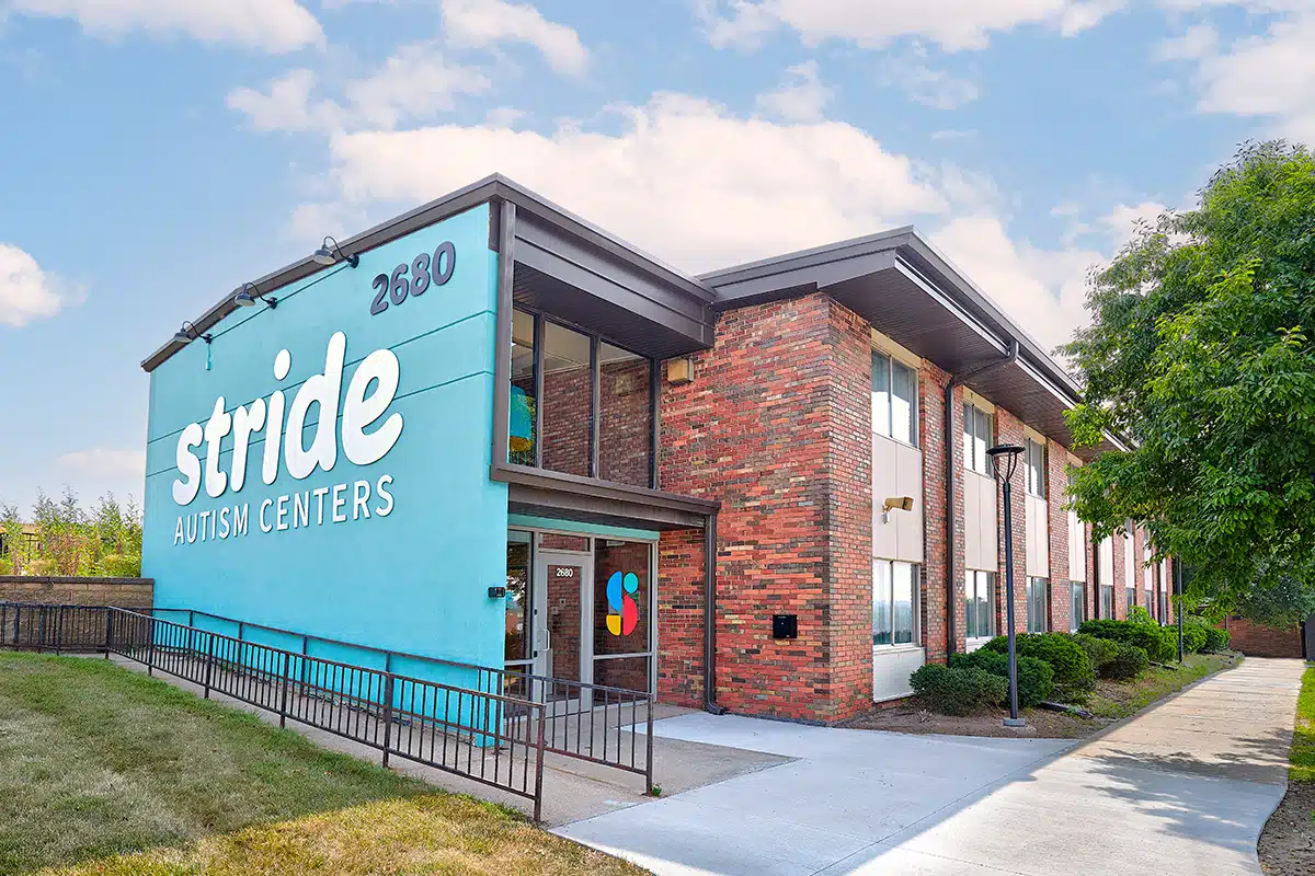 Photo of a building with a signage that reads "Stride Autism Centers."