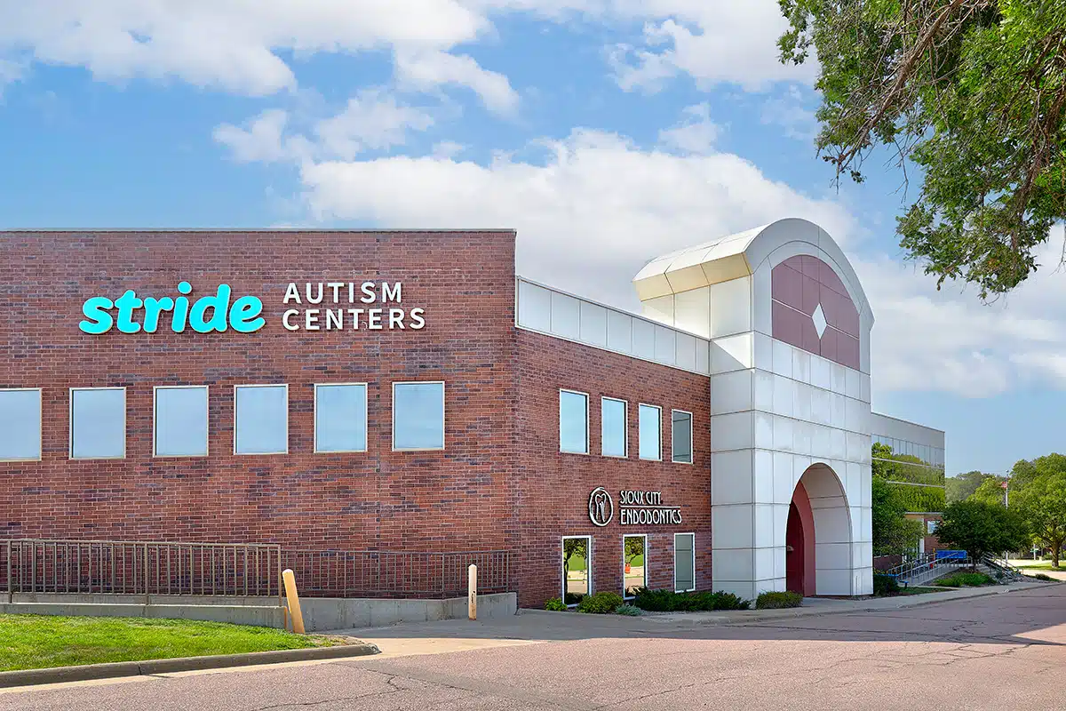 Photo of a building with a signage that reads "Stride Autism Centers."