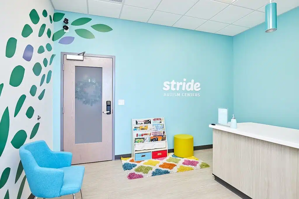 Welcoming lobby at Stride Autism Centers&reg; with a reading nook for children enrolled in early intervention ABA programs.