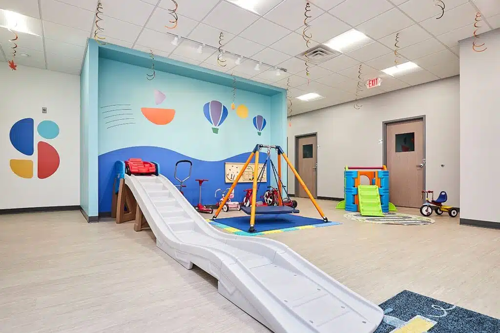 The modern interior of Stride Autism Center in West Omaha, Nebraska, featuring a clean and bright therapy workspace.
