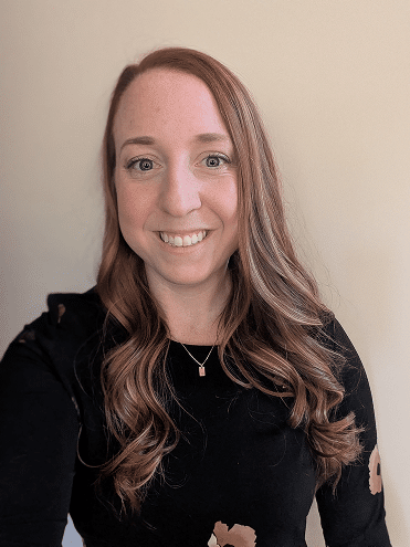 Professional headshot of a Stride Autism Centers team member wearing a black top