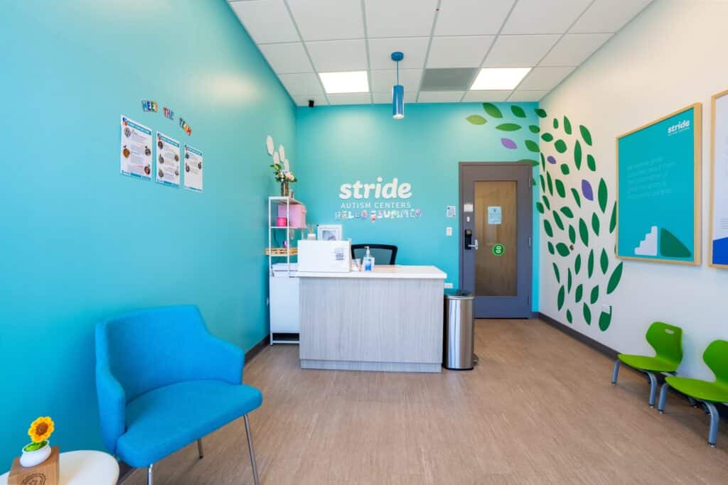A colorful and bright therapy room at Stride Autism Centers&reg; in Oak Park, IL, featuring child-sized furniture.